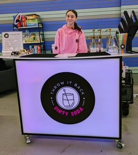 The LED glow bar lit up at an indoor event